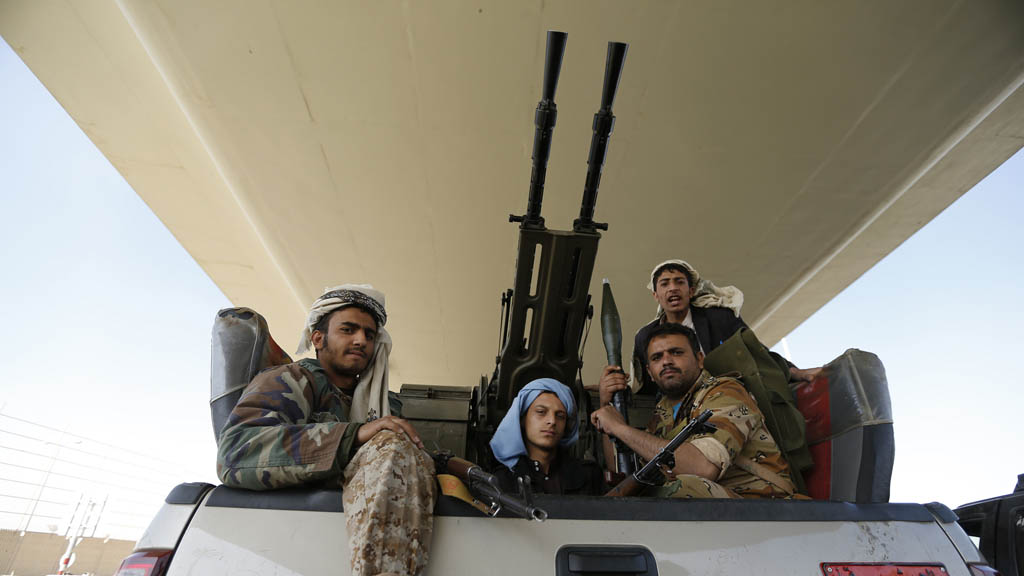 Houthi fighters outside the presidential residence in Sana'a