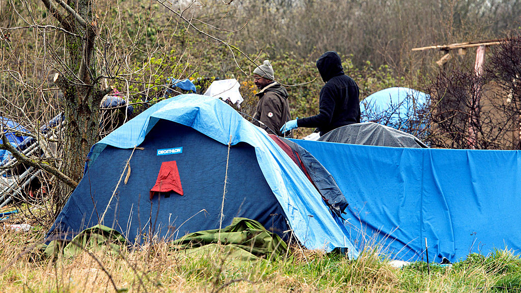 Two men at the 'new jungle' migrants' camp in Calais (Getty Images)