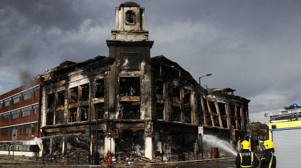 The burnt-out Carpetright store in Tottenham High Road (Reuters)