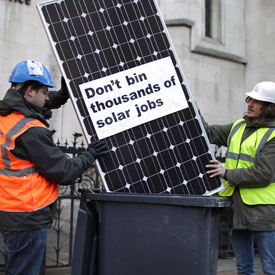 protest against cuts to solar panel subsidies (Getty)