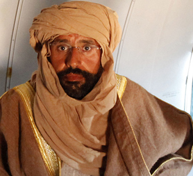 Saif Gaddafi on the plane (Image: Reuters)