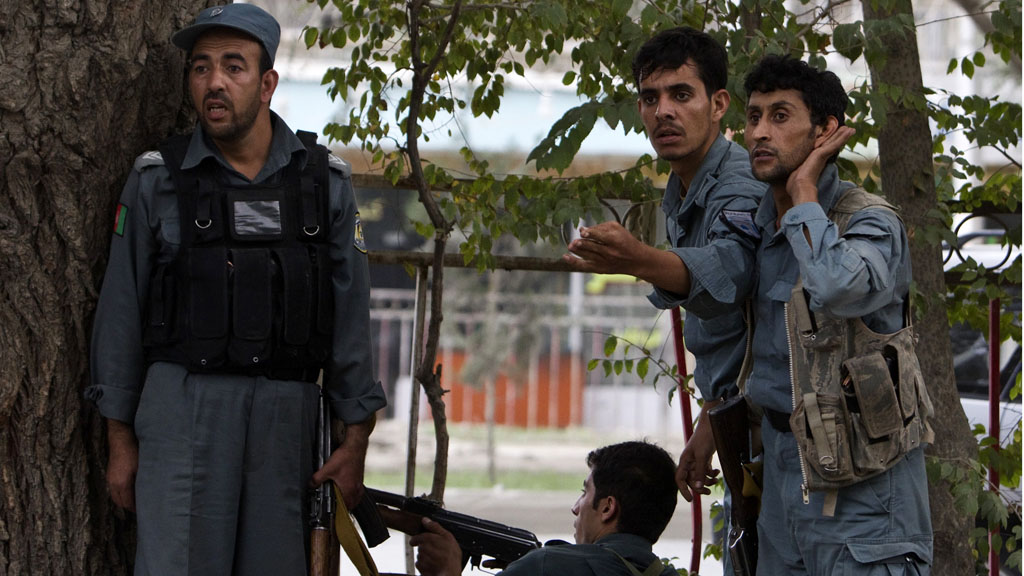 Afghan police react during a gun battle after Taliban insurgents attacked Kabul (Reuters)