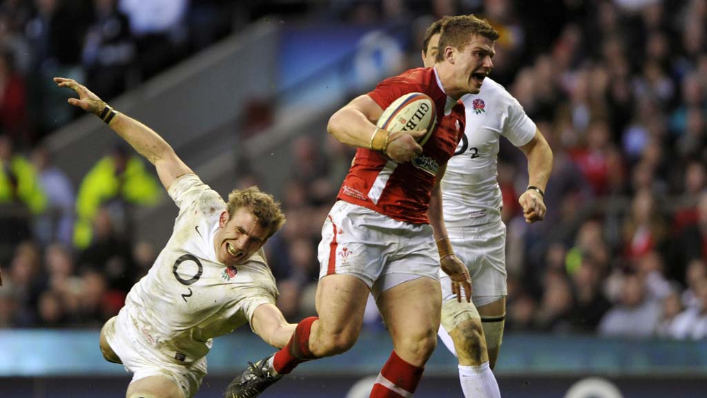 Wales' Williams evades a tackle from England's Croft to score a try against England during their international Six Nations rugby match at Twickenham in London (Reuters)