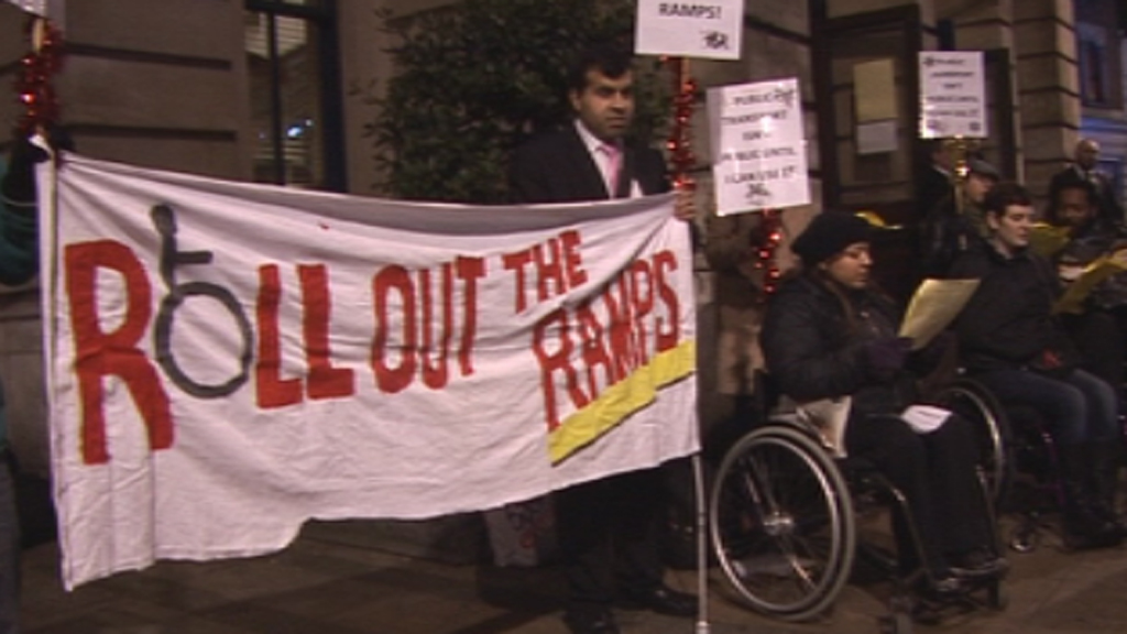 Protesters sang carols in Stratford to call for better tube access.