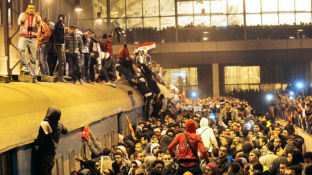 People gather at the Ramses train station in downtown Cairo. (Reuters)