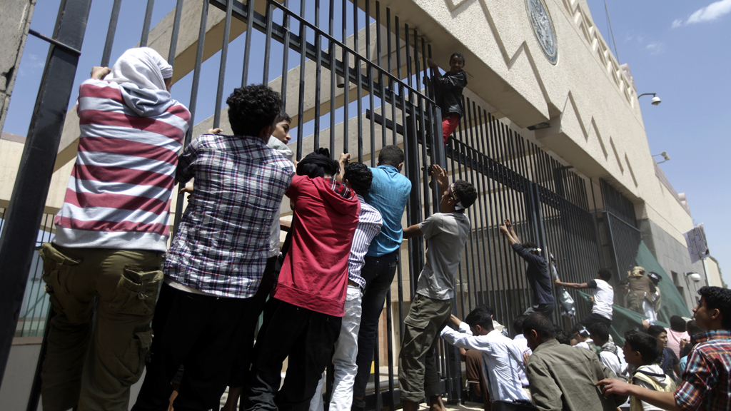 Hundreds of protesters storm the US embassy in Yemen chanting 