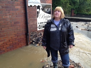 Julie Watson, shopowner, worried about flooding and looting. (Channel 4 News)
