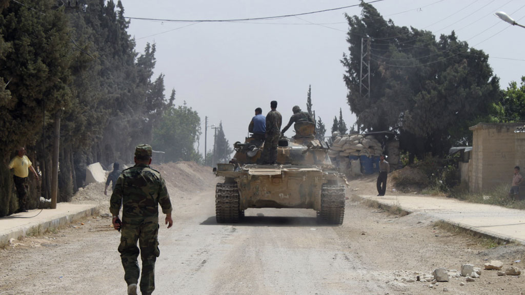 Syrian army forces advance on Qusair (pic: Reuters)