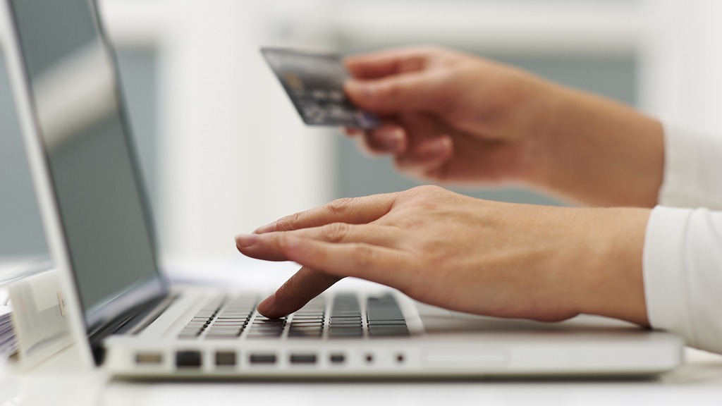 A credit card being used to buy something online (G)