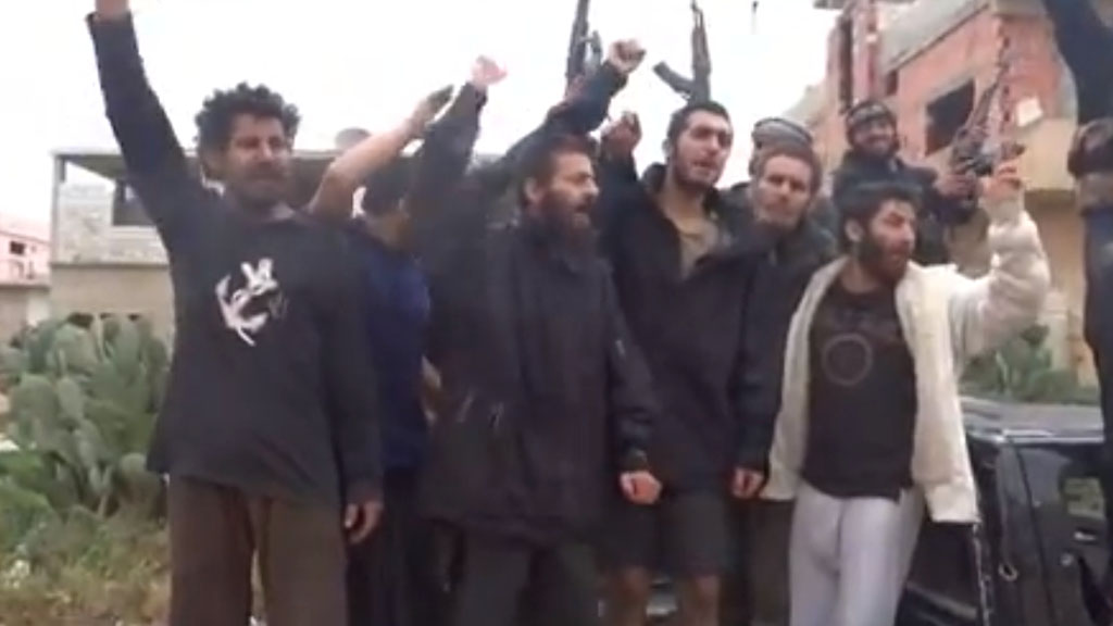 Released rebel prisoners celebrate after base's capture
