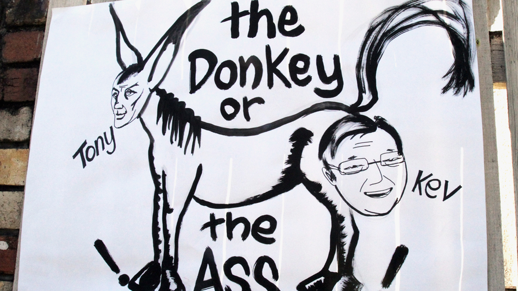 An election parody poster hangs at a polling station in Brisbane (R)