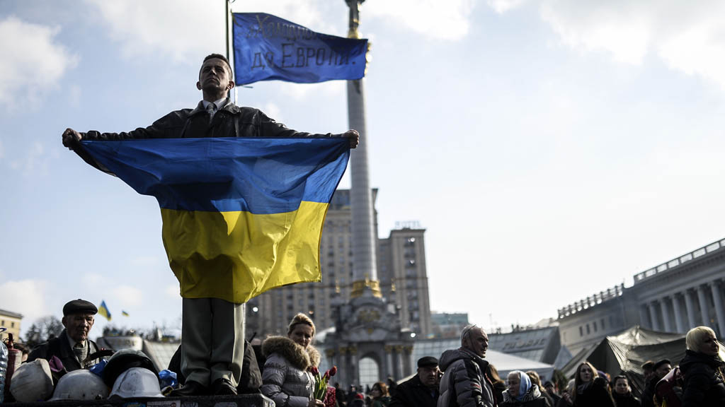 Ukraine: protester holds up flag in Kiev (picture: Getty)