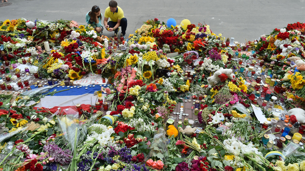 Locals mark their respect at the Dutch Embassy in Kiev, Ukraine (credit: Getty Images)