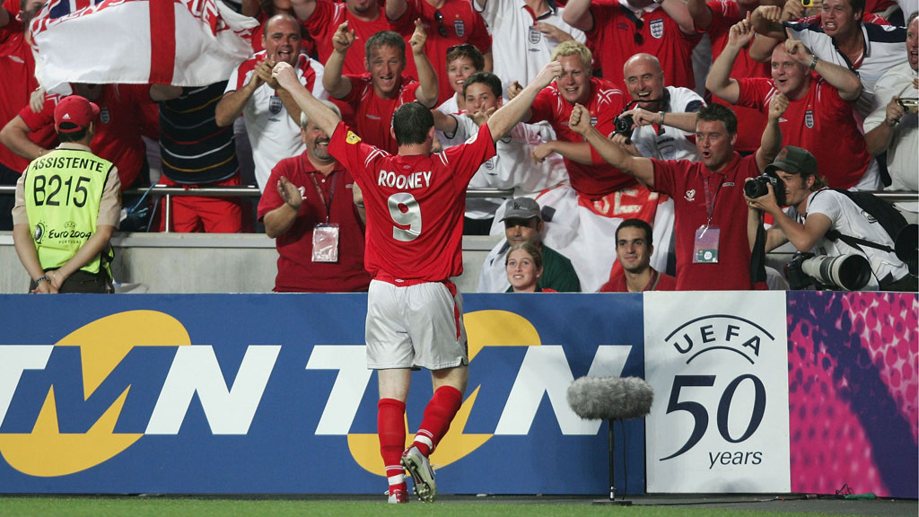 Rooney celebrates an England goal with fans at Euro 2004.