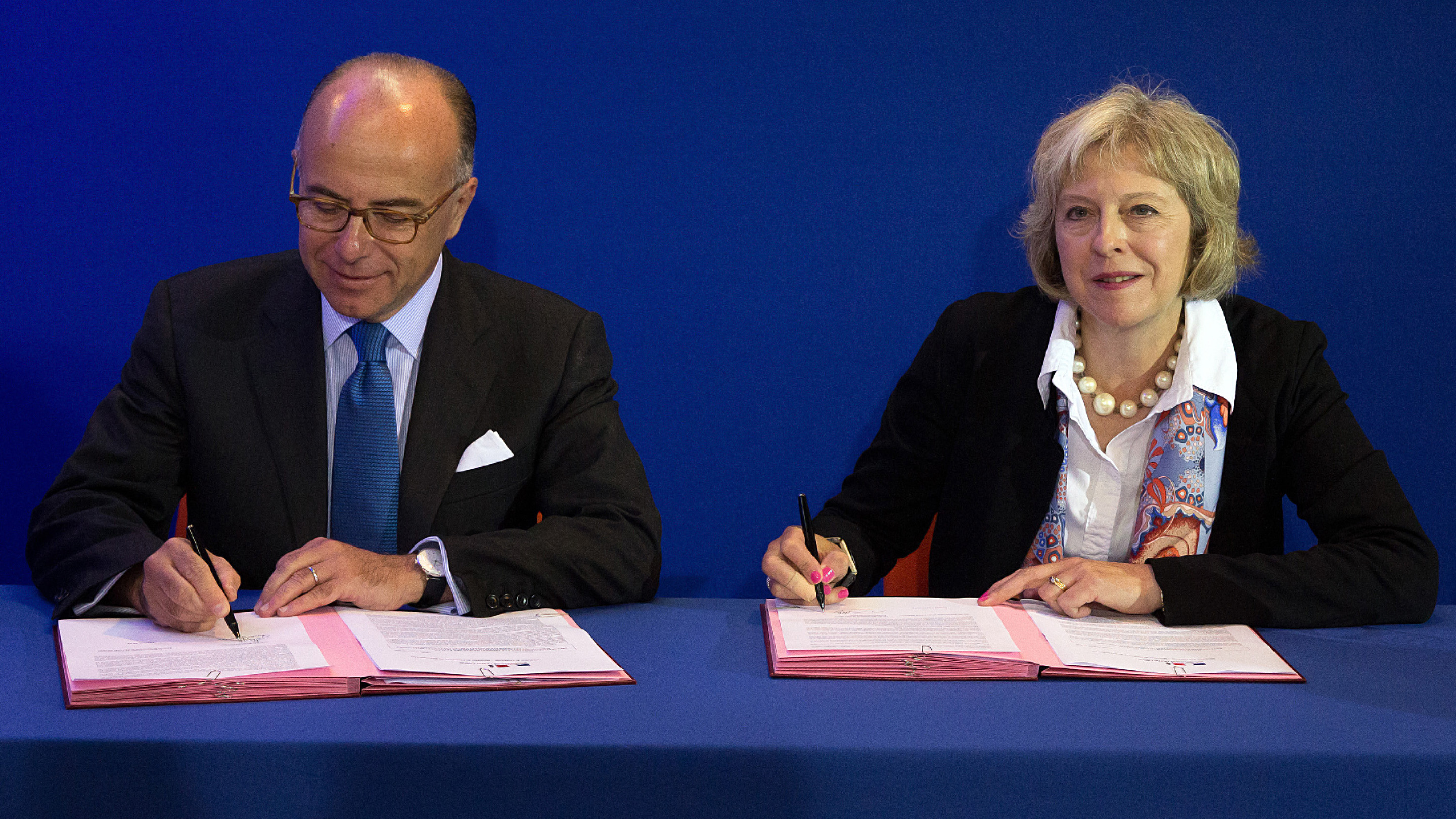 Bernard Cazeneuve and Theresa May in Calais (Getty)