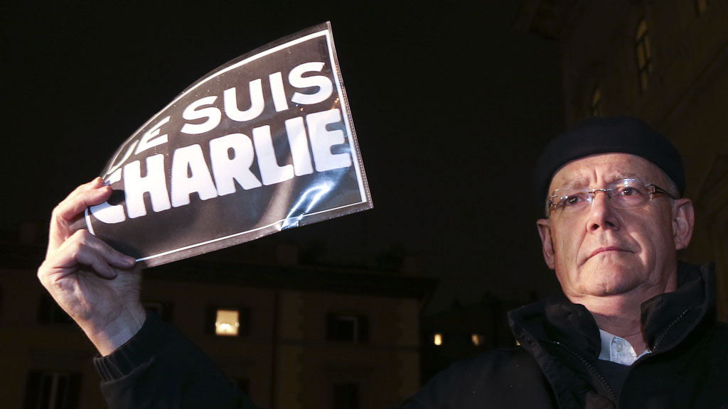 A man protests outside the French embassy in Rome