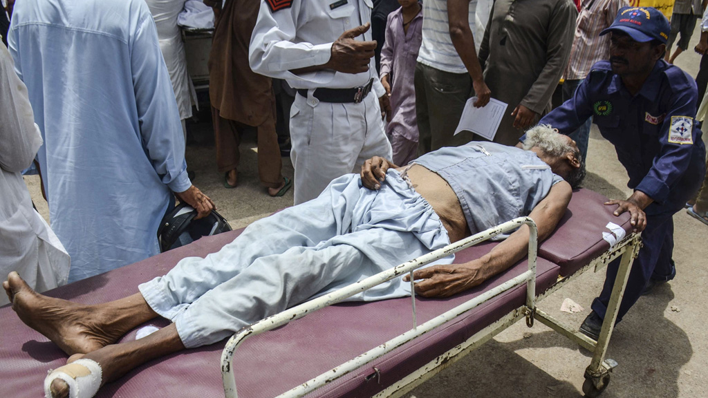 Man with heatstroke on stretcher (Getty)