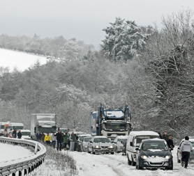 Traffic comes to a standstill in the snow. Reuters.
