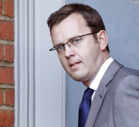 David Cameron backs communications chief Andy Coulson (Reuters)