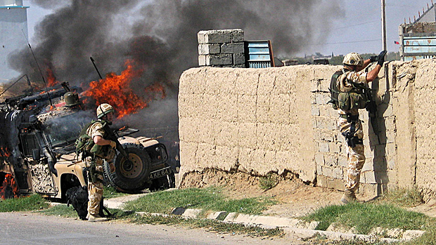 British soldiers try to secure the site of a suicide attack in Afghanistan's southern Helmand province, 2006 Reuters