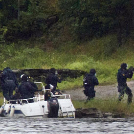 Norwegian anti-terror police arrive at Utoya island (Getty)