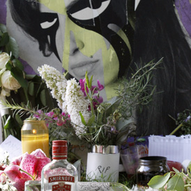 Amy Winehouse's funeral takes place - tributes have been left outside her flat (Reuters images)