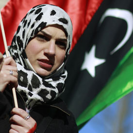 A Libyan woman protesting as the ICC says it has evidence Libyan leader Muammar Gaddafi has ordered rape to be used against female opponents (Reuters)
