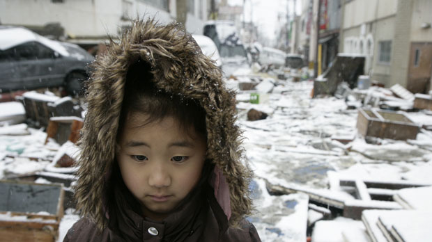 Karen stands in the tsunami ravaged streets of Ishinomaki (save the children)