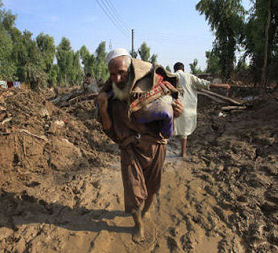 A man leaving Pabbi village with his belongings. (Reuters)
