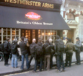 Press photographers waiting outside a pub for Wilmshurst